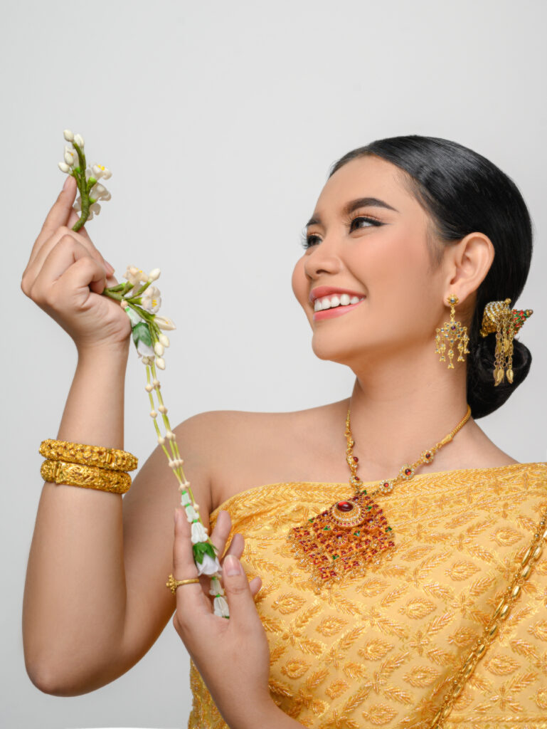 Beautiful Asian woman in traditional Thai dress costume white ba